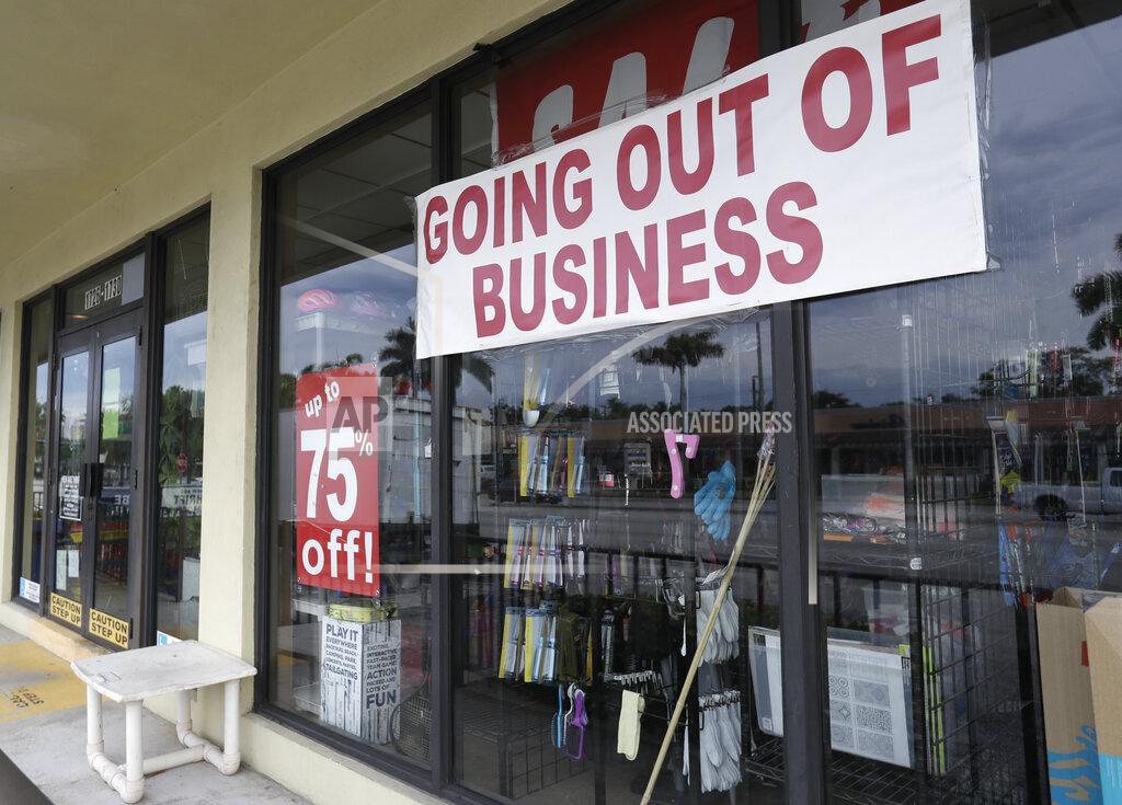 FILE - In this April 30, 2020, file photo, a store with a "Going out of Business," sign is shown n North Miami Beach, Fla. The International Monetary Fund has sharply lowered its forecast for global growth this year because it envisions far more severe economic damage from the coronavirus than it did just two months ago. (AP Photo/Wilfredo Lee, File)