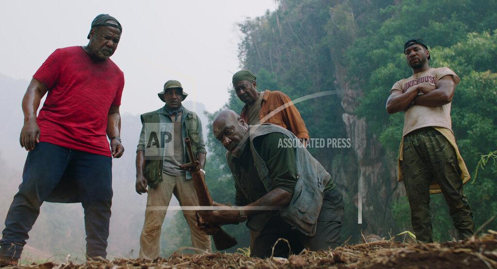 Uncredited This image released by Netflix shows Isiah Whitlock, from left, Norm Lewis, Delroy Lindo, Clarke Peters and Jonathan Majors in a scene from "Da 5 Bloods." The Screen Actors Guild has nominated the cast for a SAG Award for outstanding performance by a cast in a motion picture. (Netflix via AP)