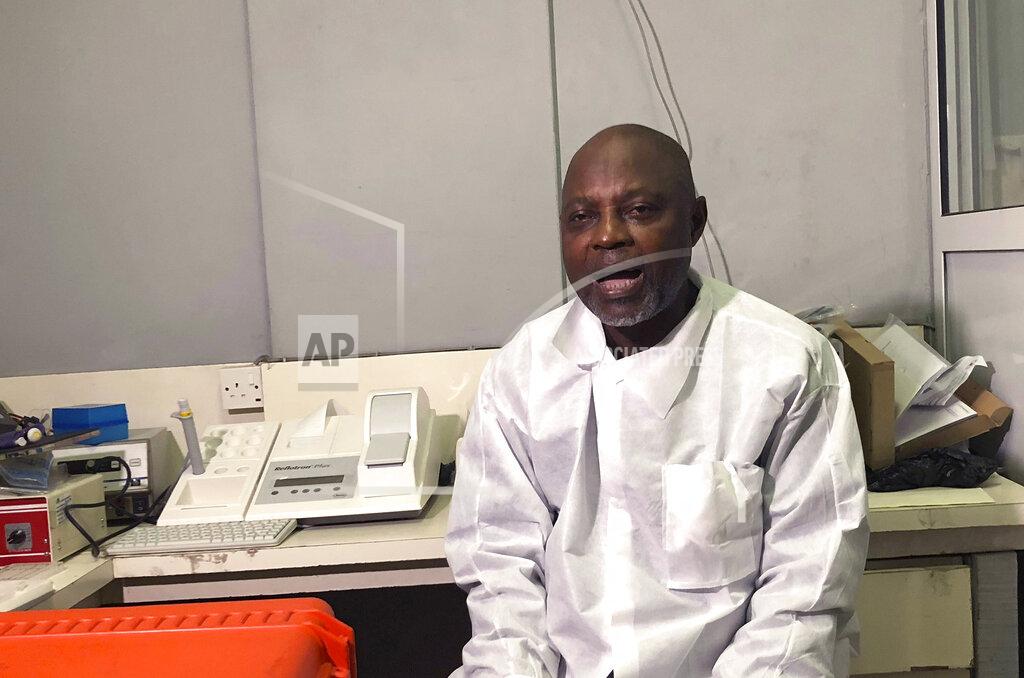 Lekan Oyekanmi In this photo taken on Friday, Dec. 25, 2020, Virologist Sunday Omilabu speaks, during an interview with The Associated Press, in Lagos, Nigeria. A Nigerian scientist has spent the holiday season in his laboratory doing genetic sequencing to learn more about the country’s COVID-19 variant, as cases increase in the country. Virologist Sunday Omilabu says the information he gathers about the variant will help battle the spread of the disease in Nigeria, Africa’s most populous country with 196 million people. (AP Photo/Lekan Oyekanmi)