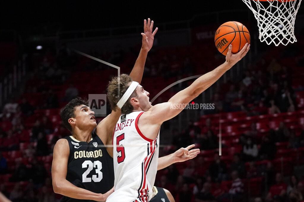 Rick Bowmer Utah guard Jaxon Brenchley (5) goes to the basket as Colorado forward Tristan da Silva (23) defends during the second half of an NCAA college basketball game Saturday, March 5, 2022, in Salt Lake City. (AP Photo/Rick Bowmer)