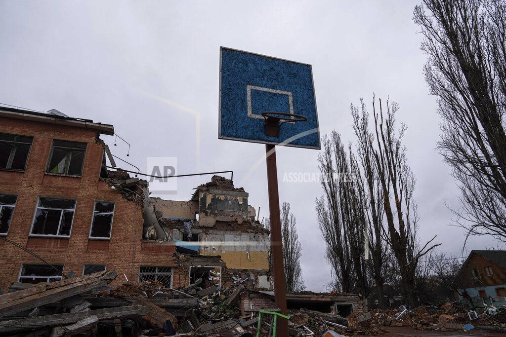 Evgeniy Maloletka FILE - A basketball hoop and backboard stands amid the damage at a school after an airstrike by Russian forces in Chernihiv, Ukraine, Wednesday, April 13, 2022. Targeting schools and other civilian infrastructure is a war crime. Experts say wide-scale wreckage can be used as evidence of Russian intent, and to refute claims that schools were simply collateral damage. (AP Photo/Evgeniy Maloletka, File)