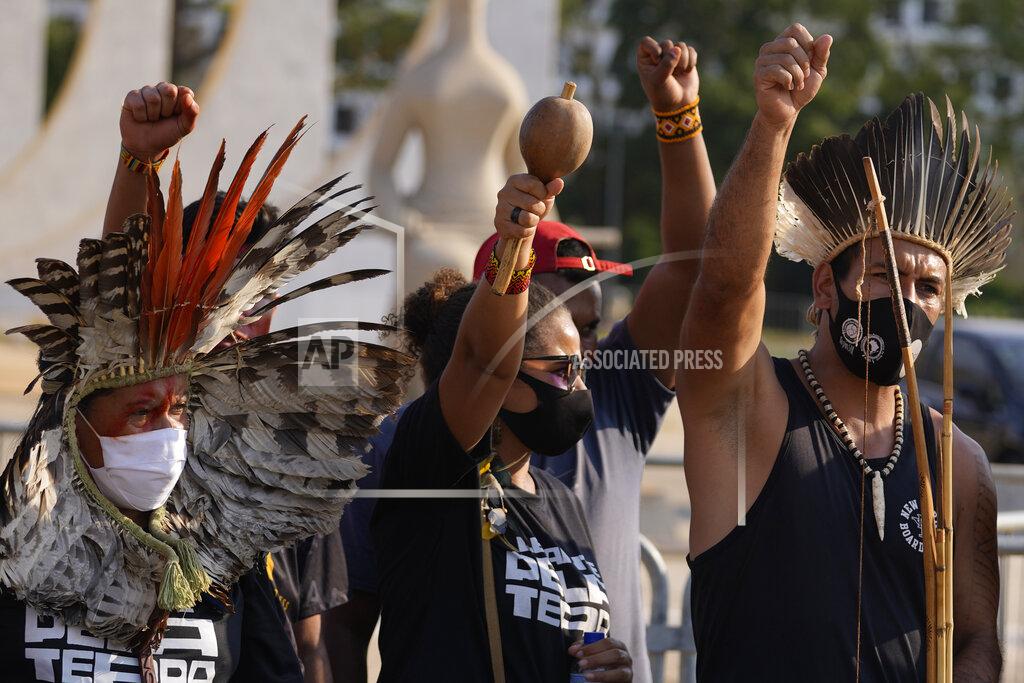 Eraldo Peres Indigenous people react after the Supreme Court judges' decision to suspend the vote that defines the demarcation of indigenous lands, during a protest in front of the Supreme Court building, in Brasilia, Brazil, Wednesday, Sept. 15, 2021. (AP Photo/Eraldo Peres)