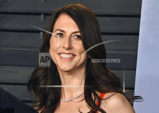FILE - In this March 4, 2018, file photo, then-MacKenzie Bezos arrives at the Vanity Fair Oscar Party in Beverly Hills, Calif. In a blog post Wednesday, Dec. 8, 2021, titled “No Dollar Signs This Time,” billionaire philanthropist MacKenzie Scott said she won’t say how much she has given away to charity since her last round of donations in an effort to draw attention away from herself. (Photo by Evan Agostini/Invision/AP, File)
