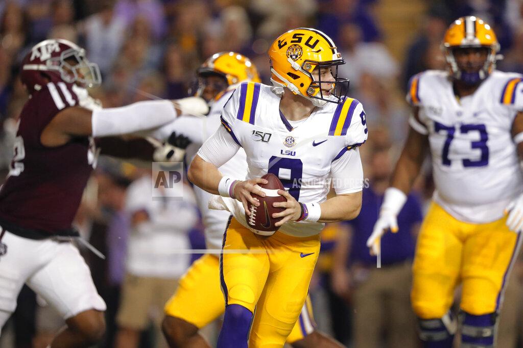 Gerald Herbert LSU quarterback Joe Burrow (9) looks for a receiver during the first half of the team's NCAA college football game against Texas A&M in Baton Rouge, La., Saturday, Nov. 30, 2019. (AP Photo/Gerald Herbert)