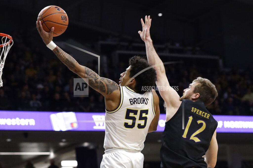 Nam Y. Huh Michigan guard Eli Brooks, left, drives to the basket past Northwestern guard Pat Spencer during the first half of an NCAA college basketball game in Evanston, Ill., Wednesday, Feb. 12, 2020. (AP Photo/Nam Y. Huh)