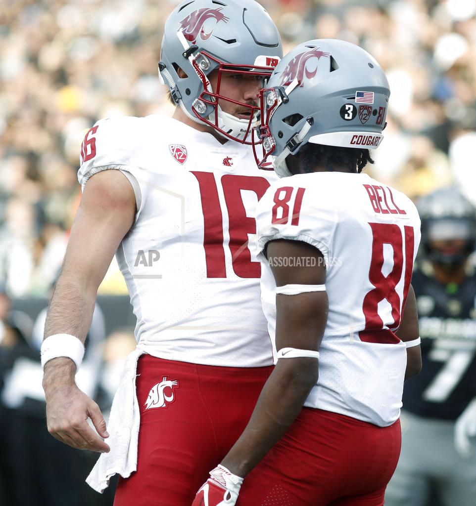 David Zalubowski Washington State quarterback Gardner Minshew, left, congratulates wide receiver Renard Bell after his touchdown catch against Colorado in the second half of an NCAA college football game Saturday, Nov. 10, 2018, in Boulder, Colo. Washington State won 31-7. (AP Photo/David Zalubowski)