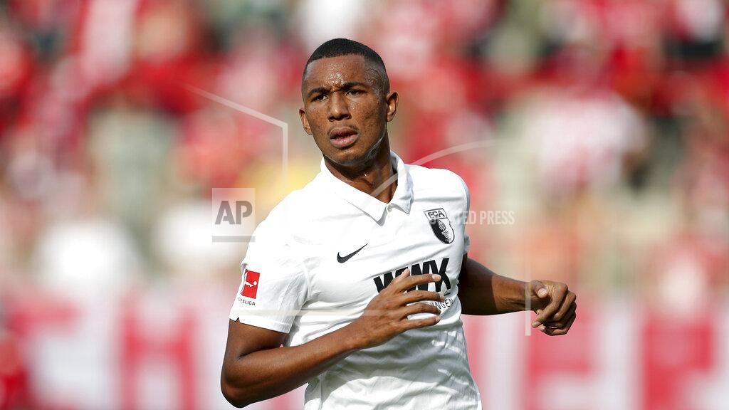 Michael Sohn FILE - In this Sept 19, 2020 file photo, Augsburg's Felix Uduokhai plays during the German Bundesliga soccer match between 1. FC Union Berlin and FC Augsburg in Berlin, Germany. Germany coach Joachim Loew has called up two debutants for his team’s upcoming friendly against the Czech Republic and Nations League games against Ukraine and Spain. Loew named PSV Eindhoven’s Philipp Max and Augsburg’s Felix Uduokhai, both defenders, in his 29-member squad Friday, when Thilo Kehrer (Paris Saint-Germain), Ilkay Gundogan (Manchester City) and Leroy Sane (Bayern Munich) also returned after missing the October internationals. (AP Photo/Michael Sohn, FILE)