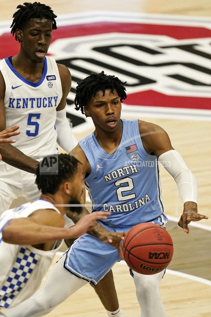 Tony Dejak North Carolina's Caleb Love (2) passes against Kentucky in the first half of an NCAA college basketball game, Saturday, Dec. 19, 2020, in Cleveland. North Carolina won 75-63. (AP Photo/Tony Dejak)