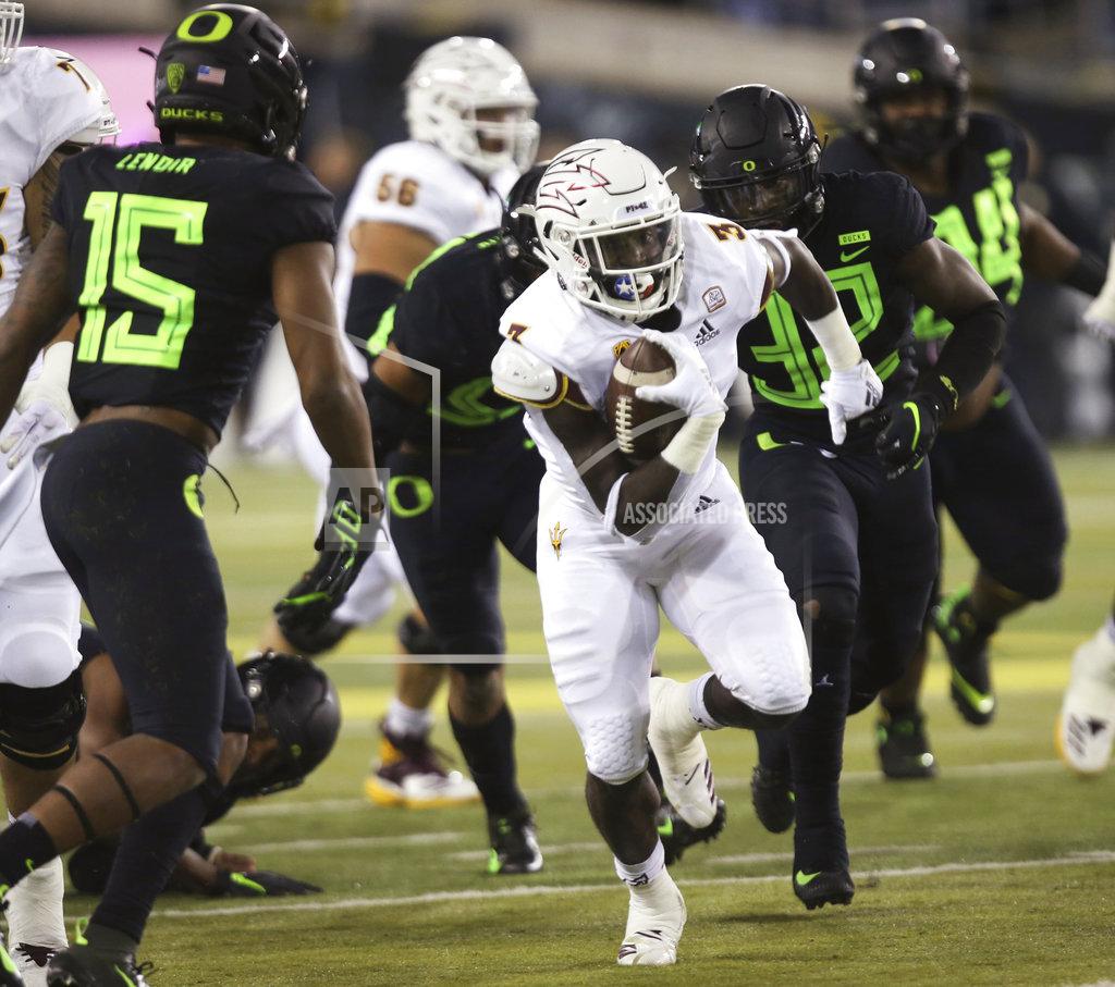 Chris Pietsch Arizona State's Eno Benjamin runs against Oregon defenders during the first quarter of an NCAA college football game Saturday, Nov. 17, 2018, in Eugene, Ore. (AP Photo/Chris Pietsch)