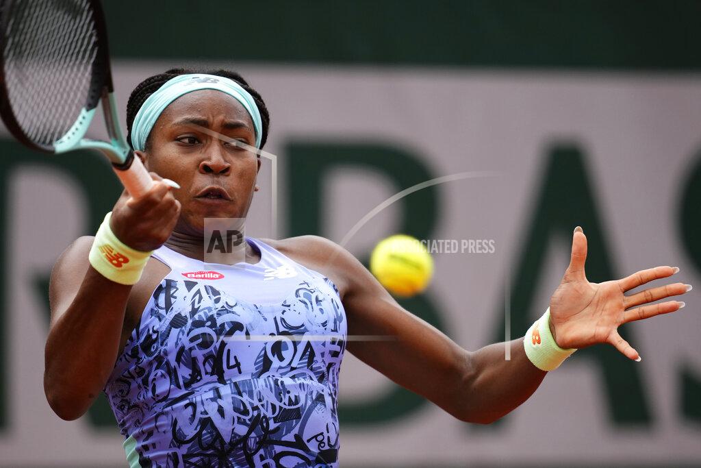 Christophe Ena Coco Gauff of the U.S. returns the ball to Estonia's Kaia Kanepi during their third round match of the French Open tennis tournament at the Roland Garros stadium Friday, May 27, 2022 in Paris. (AP Photo/Christophe Ena)