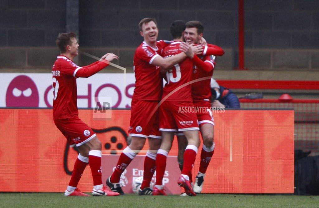 Ian Walton Crawley Town's Jordan Tunnicliffe, right, celebrates after scoring his side's third goal during the English FA Cup third round soccer match between Crawley Town and Leeds United at Broadfield Stadium in Crawley, England, Sunday, Jan. 10, 2021. (AP Photo/Ian Walton)