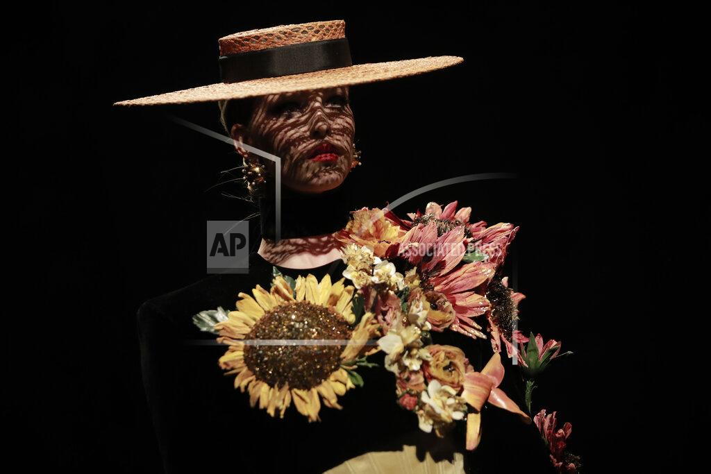 Lewis Joly A model wears a creation for Schiaparelli's Haute Couture Fall/Winter 2022-2023 fashion collection, Monday, July 4, 2022 in Paris. (AP Photo/Lewis Joly)