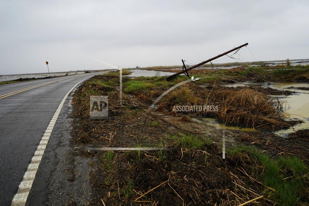 Gerald Herbert Downed power lines from Hurricane Laura line a desolate stretch of marsh on Hwy 27, leading to the town of Cameron, La., in advance of Hurricane Delta, in Cameron Parish, La., Thursday, Oct. 8, 2020. (AP Photo/Gerald Herbert)