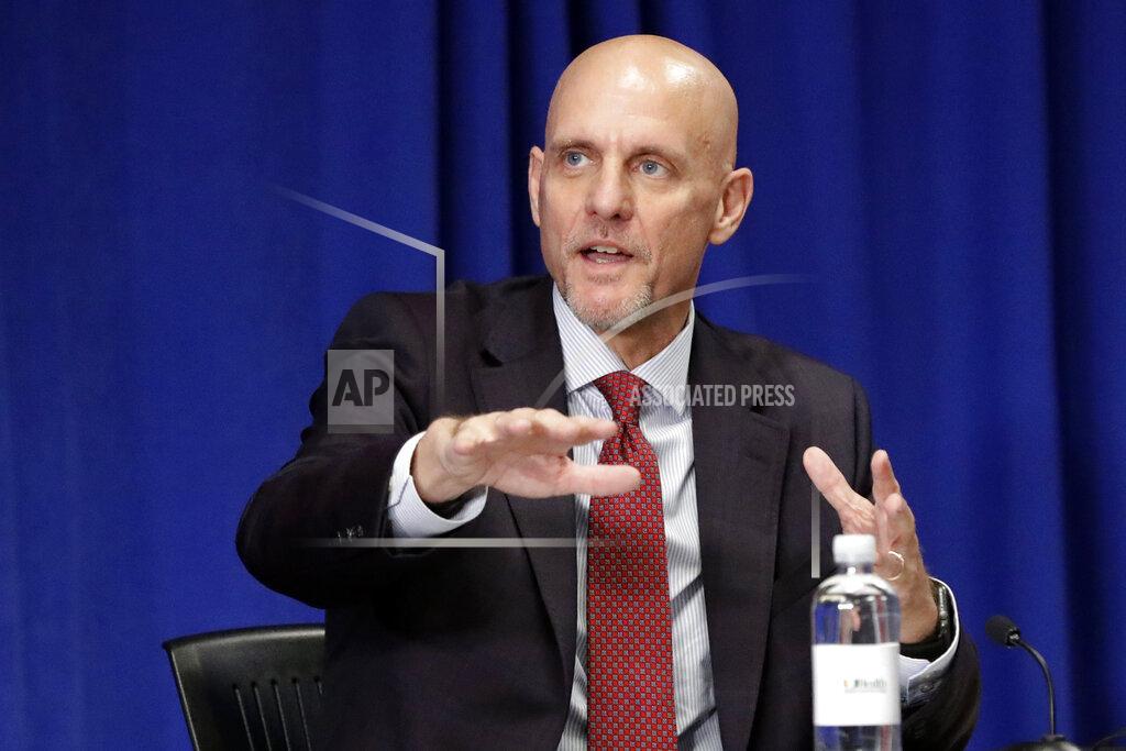 Wilfredo Lee Food and Drug Administration Commissioner Dr. Stephen Hahn gestures as he speaks during a roundtable discussion at the University of Miami Miller School of Medicine Don Soffer Clinical Research Center, Monday, July 27, 2020, in Miami. Pence was in Florida to mark the beginning of Phase III trials for a Coronavirus vaccine. (AP Photo/Wilfredo Lee)