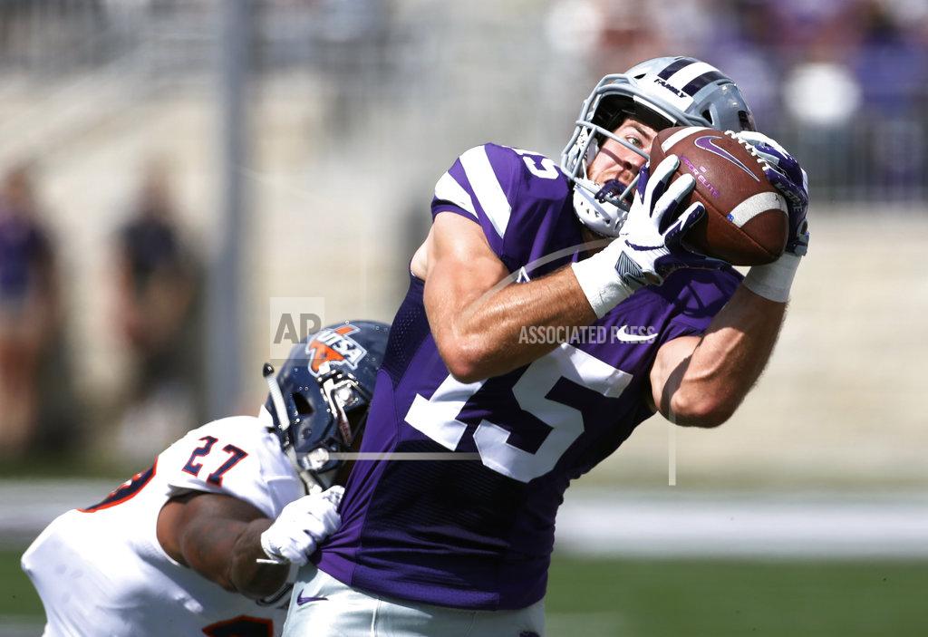 Kansas State wide receiver Zach Reuter (15) catches a 38-yard pass as UTSA cornerback Teddrick McGhee (27) defends during the first quarter of a college football game in Manhattan, Kan., Saturday, Sept. 15, 2018. (AP Photo/Colin E. Braley)