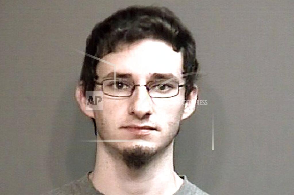 This undated photo provided by Boone County Sheriff's Department in Columbia, Mo., shows Joseph Elledge. The University of Missouri student was charged Monday, Oct. 28, 2019, with abuse or neglect of a child as authorities continue searching for his wife, Menqi Ji Elledge, a graduate of the school who is from China. Menqi Ji Elledge was last seen on Oct. 9. The parents of Menqi Ji Elledge and her jailed U.S. husband both want guardianship of the couple's 1-year-old daughter. An attorney for the parents of 28-year-old Mengqi Ji Elledge said a written statement that it is in the