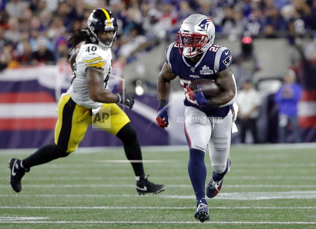 Elise Amendola New England Patriots running back James White (28) runs from Pittsburgh Steelers outside linebacker Bud Dupree (48) after catching a pass from wide receiver Julian Edelman in the first half an NFL football game, Sunday, Sept. 8, 2019, in Foxborough, Mass. (AP Photo/Elise Amendola)