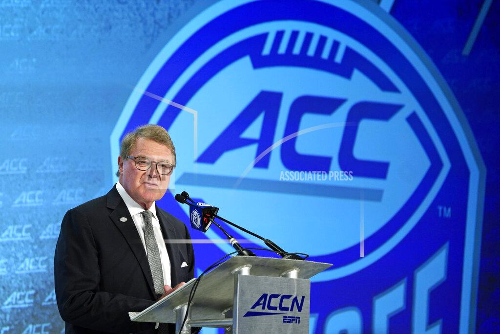 Chuck Burton FILE - In this July 17, 2019, fil photo, Commissioner John Swofford speaks during the Atlantic Coast Conference NCAA college football media day in Charlotte, N.C. As virus disruptions mount and the Dec. 19 end of college football's regular season draws closer, the possibility grows that conference championships, major awards and even College Football Playoff participants will be determined by COVID-19. “We’ve all accepted this is anything but a normal year,” ACC Commissioner John Swofford said. (AP Photo/Chuck Burton, File)