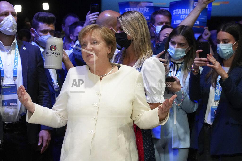 Matthias Schrader German chancellor Angela Merkel arrives for a state election campaign in Munich, Germany, Friday, Sept. 24, 2021 two days before the General election on Sunday, Sept. 26, 2021. (AP Photo/Matthias Schrader)