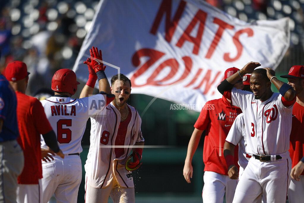 Nick Wass Washington Nationals' Carter Kieboom (8) high-fives Alex Avila (6) after hitting a walkoff single to drive in Josh Bell during the ninth inning of a baseball game against the New York Mets, Monday, Sept. 6, 2021, in Washington. Nationals' Alcides Escobar, right, looks on. (AP Photo/Nick Wass)