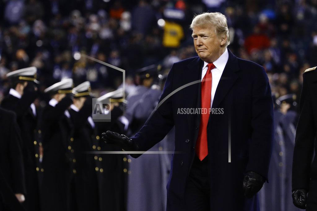 Matt Rourke President Donald Trump crosses the field after the first half of an NCAA college football game between the Army and the Navy, Saturday, Dec. 8, 2018, in Philadelphia. (AP Photo/Matt Rourke)