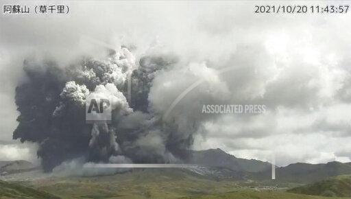 In this image taken by a surveillance camera released by Japan Meteorological Agency, smokes rise from the No. 1 Nakadake crater of Mr. Aso after its eruption, observed from Kusasenri, southwestern Japan, Wednesday, Oct. 20, 2021. The eruption occurred at 11:43 a.m., according to the agency. (Japan Meteorological Agency via AP)