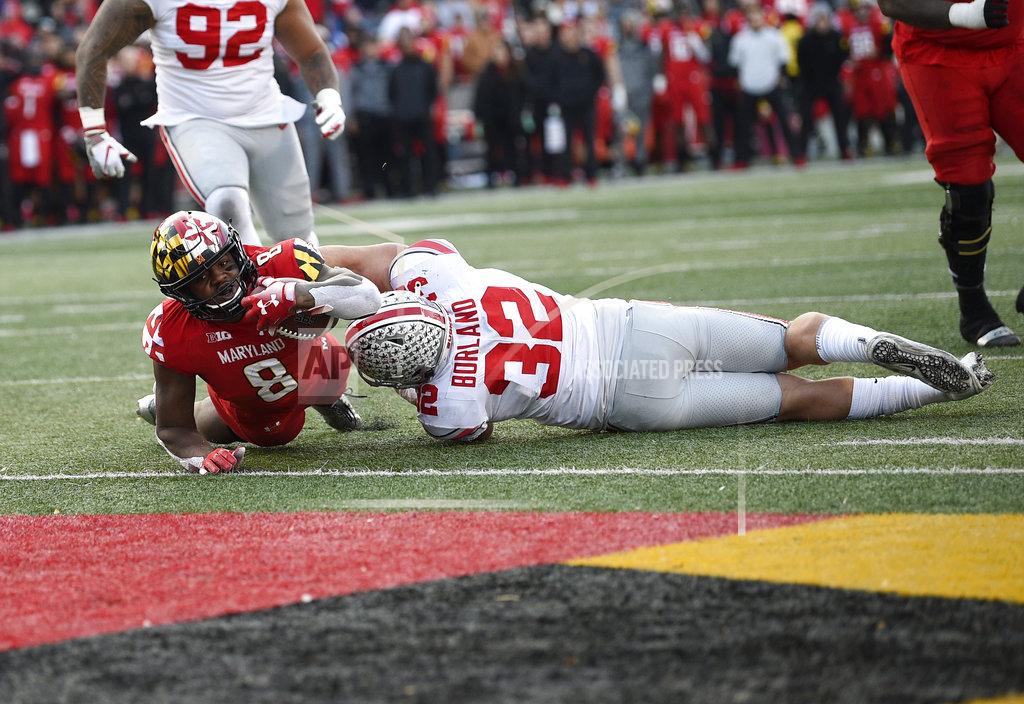 Nick Wass Maryland running back Talon Fleet-Davis (8) dives for a touchdown during overtime of an NCAA football game against Ohio State linebacker Tuf Borland (32), Saturday, Nov. 17, 2018, in College Park, Md. Ohio State won 52-51 in overtime. (AP Photo/Nick Wass)