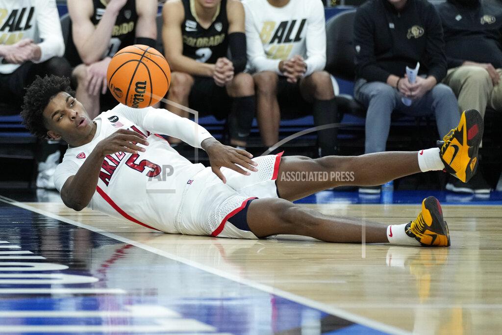 John Locher Arizona's Justin Kier (5) tries to keep the ball in bounds against Colorado during the second half of an NCAA college basketball game in the semifinal round of the Pac-12 tournament Friday, March 11, 2022, in Las Vegas. (AP Photo/John Locher)
