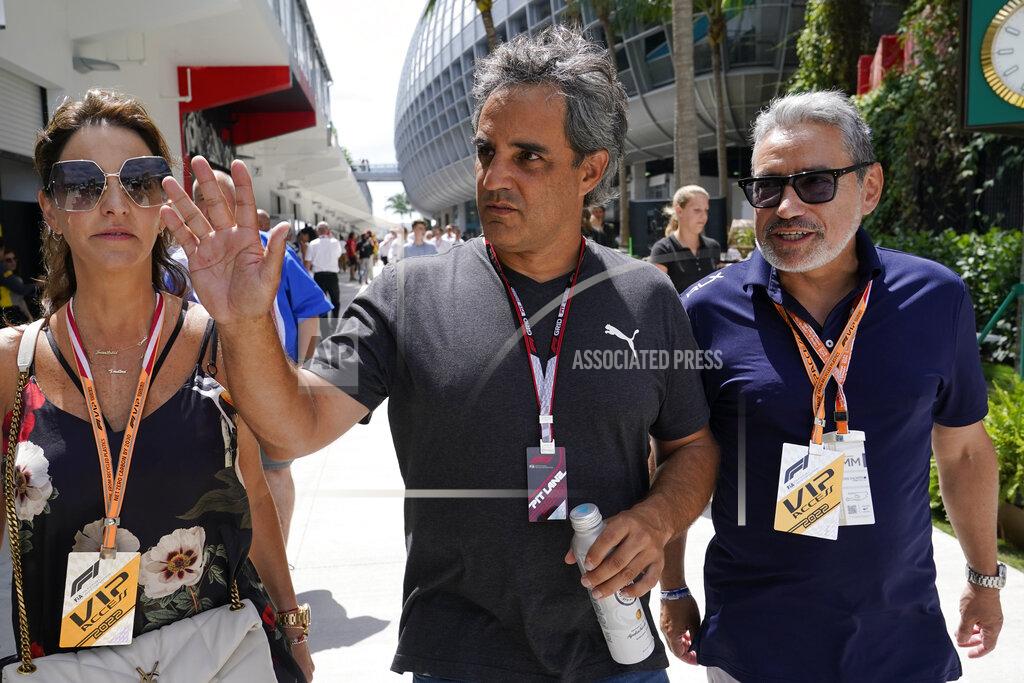 Lynne Sladky Indy car driver Juan Pablo Montoya, center, arrives for the third practice session for the Formula One Miami Grand Prix auto race at the Miami International Autodrome, Saturday, May 7, 2022, in Miami Gardens, Fla. (AP Photo/Lynne Sladky)