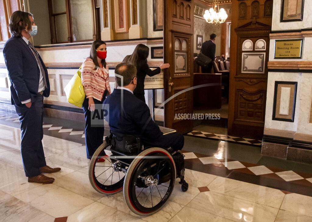 Justin L. Fowler Illinois Senate Minority Leader Dan McConchie, R-Hawthorn Woods, is unable to enter the lawmakers section of the hearing room that is not handicap accessible for a public hearing with the House and Senate redistricting committees on the proposed boundaries for new state legislative districts at the Illinois State Capitol in Springfield, Ill., Tuesday, May 25, 2021. (Justin L. Fowler/The State Journal-Register via AP)