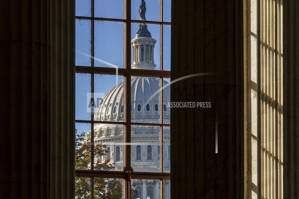 FILE - In this Nov. 10, 2020, file photo the morning sun illuminates the rotunda of the Russell Senate Office Building on Capitol Hill in Washington. After months of shadowboxing amid a tense and toxic campaign, Capitol Hill's main players are returning to Washington for one final, perhaps futile, attempt at deal making on a challenging menu of year-end business. (AP Photo/J. Scott Applewhite, File)