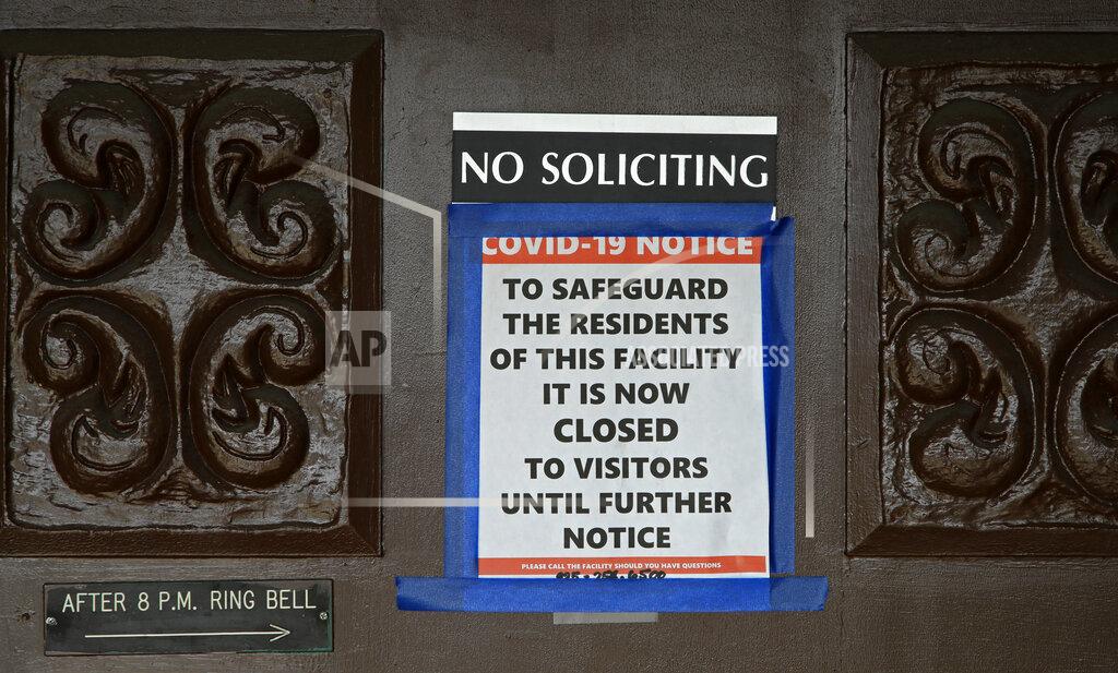 Ben Margot A sign at the entrance to the Orinda Care Center stating the center is now closed to visitors is seen on Wednesday, April 8, 2020, in Orinda, Calif. This San Francisco Bay Area facility had nearly 50 COVID-19 cases with one fatality. (AP Photo/Ben Margot)