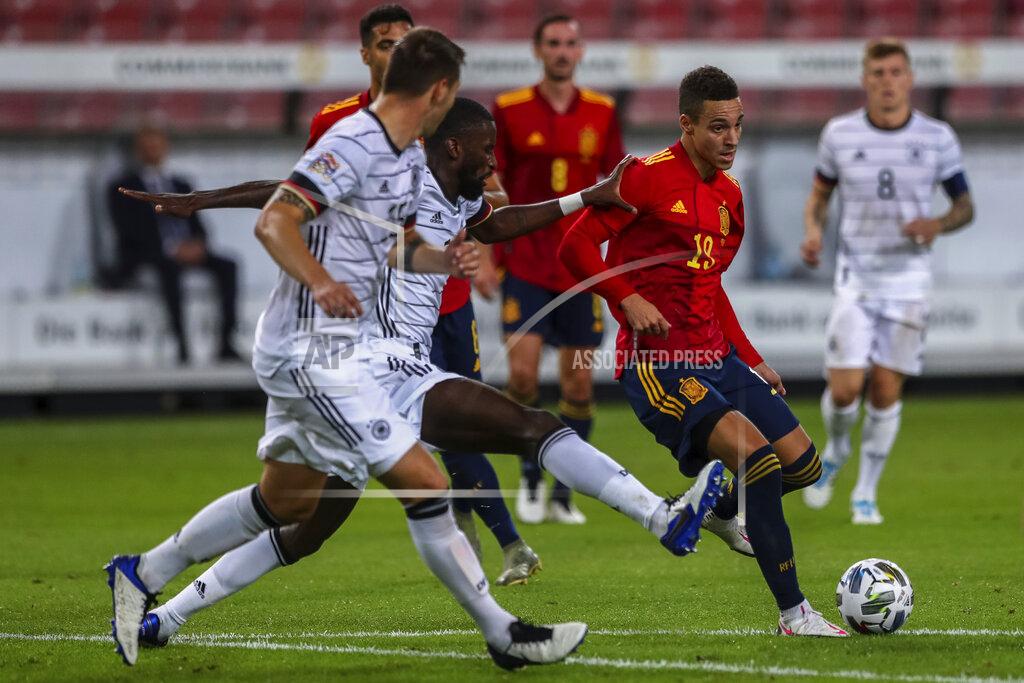 Matthias Schrader Spain's Rodrigo Moreno, right, runs past Germany player during the UEFA Nations League soccer match at the Mercedes-Benz Arena stadium in Stuttgart, Germany, Thursday, Sept. 3, 2020. (AP Photo/Matthias Schrader)