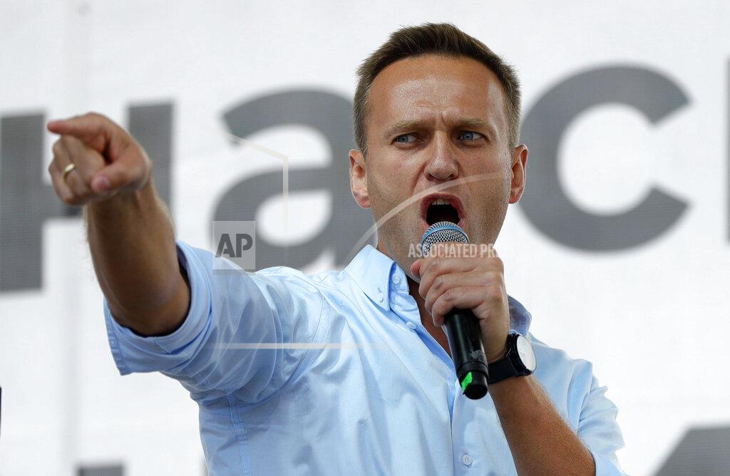 Pavel Golovkin FILE - In this Saturday, July 20, 2019 file photo Russian opposition activist Alexei Navalny gestures while speaking to a crowd during a political protest in Moscow, Russia. Russian opposition politician Alexei Navalny was placed on a ventilator in a hospital intensive care unit in Siberia after falling ill from suspected poisoning during a flight, his spokeswoman said Thursday Aug. 20, 2020. (AP Photo/Pavel Golovkin, File)