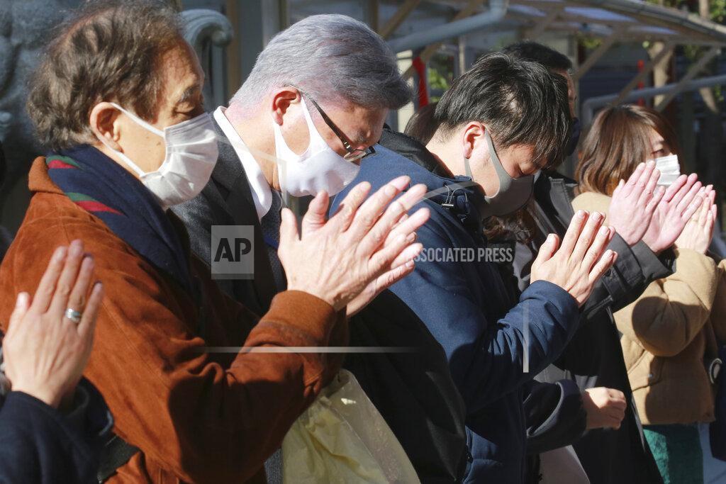 Koji Sasahara People wearing face masks to protect against the spread of the coronavirus offer prayers for New Year at the Kanda Myojin Shrine on the first business day of the year, in Tokyo, Monday, Jan. 4, 2021. Kanda Myojin is known as the shrine of commerce and industry. (AP Photo/Koji Sasahara)