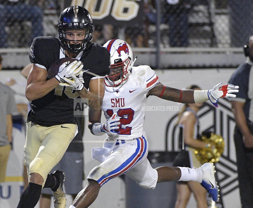 Phelan M. Ebenhack Central Florida wide receiver Tre Nixon, left, catches a pass in front of SMU cornerback Kevin Johnson (12) for a 30-yard touchdown during the second half of an NCAA college football game Saturday, Oct. 6, 2018, in Orlando, Fla. UCF won 48-20. (AP Photo/Phelan M. Ebenhack)