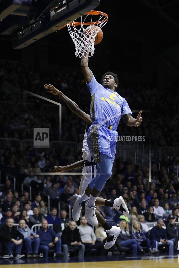 Darron Cummings Marquette's Sacar Anim (2) goes up for a dunk against Butler's Kamar Baldwin during the second half of an NCAA college basketball game, Wednesday, Jan. 30, 2019, in Indianapolis. Marquette won 76-58. (AP Photo/Darron Cummings)