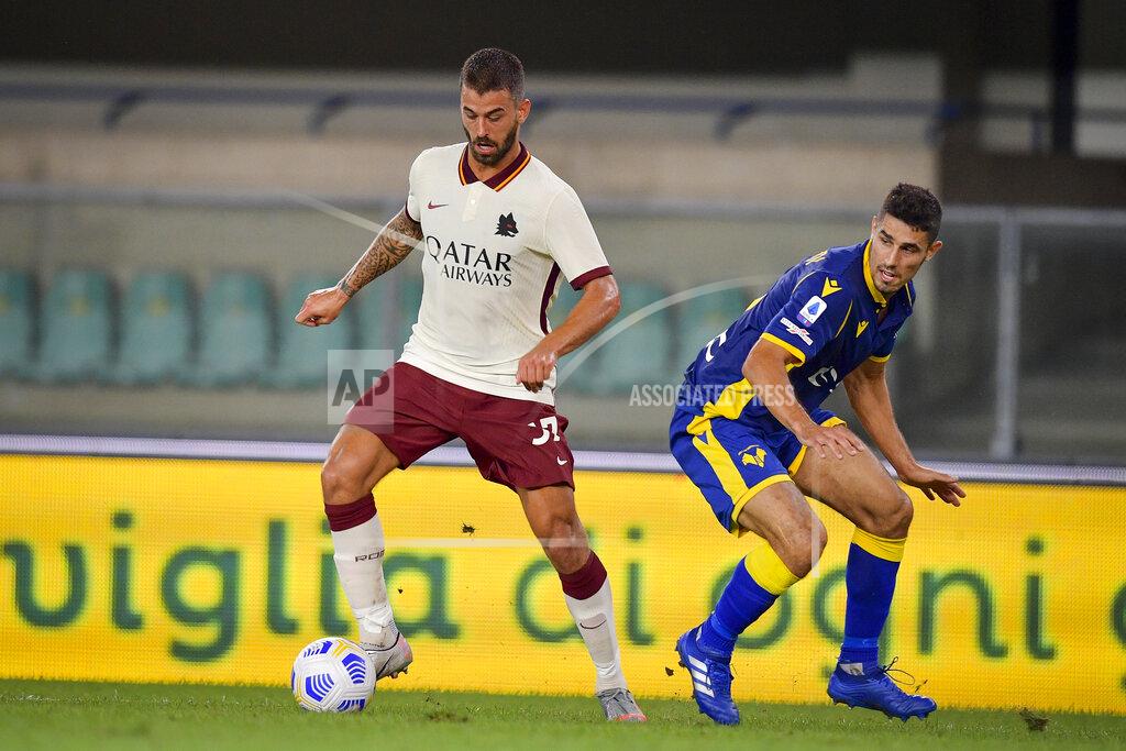 Fabio Rossi Roma's Leonardo Spinazzola, left, competes for the ball during an Italian Serie A soccer match between Verona and Roma at the Bentegodi stadium in Verona, Italy, Saturday, Sept. 19, 2020. (Fabio Rossi/LaPresse via AP)