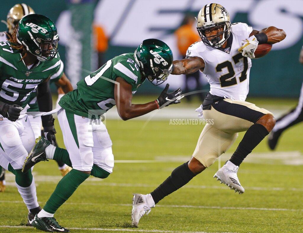 Noah K. Murray New Orleans Saints' Dwayne Washington (27) stiff-arms New York Jets' Marcus Maye (20) during the first half of a preseason NFL football game Saturday, Aug. 24, 2019, in East Rutherford, N.J. (AP Photo/Noah K. Murray)