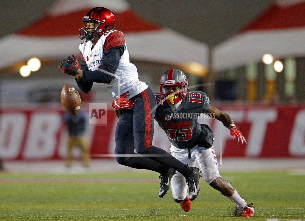 Andres Leighton San Diego State wide receiver Isiah Macklin, left, misses a reception as he's defended by New Mexico cornerback Jalin Burrell (13) during the second half of an NCAA college football game in Albuquerque, N.M., Saturday, Nov. 3, 2018. San Diego State won 31-23. (AP Photo/Andres Leighton)