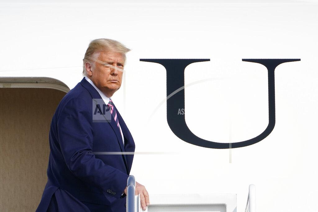 President Donald Trump boards Air Force One at Andrews Air Force Base, Md., Friday, Sept. 18, 2020. Trump is heading to Minnesota for a campaign rally. (AP Photo/Susan Walsh)