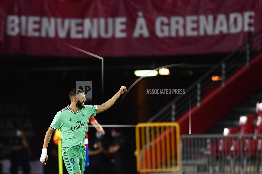 Jose Breton Real Madrid's Karim Benzema celebrates after scoring his side's second goal during the Spanish La Liga soccer match between Granada and Real Madrid at the Los Carmenes stadium in Granada, Spain, Monday, July 13, 2020. (AP Photo/Jose Breton)