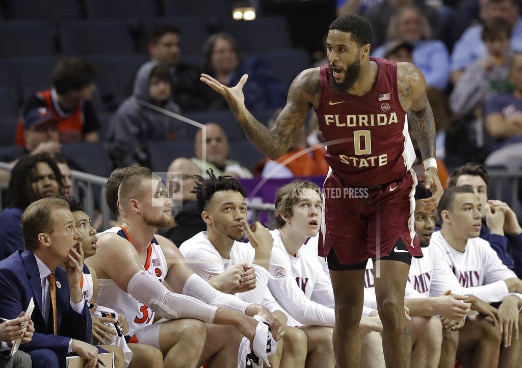 Chuck Burton Florida State's Phil Cofer (0) gestures toward the Virginia bench after making a basket during the first half of an NCAA college basketball game in the Atlantic Coast Conference tournament in Charlotte, N.C., Friday, March 15, 2019. (AP Photo/Chuck Burton)