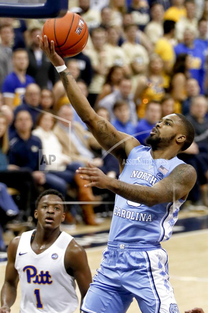 Keith Srakocic North Carolina's Seventh Woods, right, shoots in front of Pittsburgh's Xavier Johnson (1) during the second half of an NCAA college basketball game, Saturday, Jan. 5, 2019, in Pittsburgh. (AP Photo/Keith Srakocic)