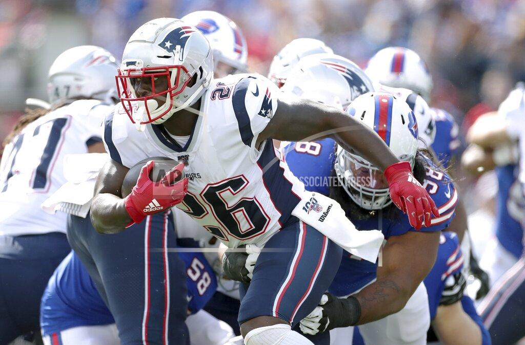 Ron Schwane New England Patriots running back Sony Michel tires to run away from Buffalo Bills defensive tackle Star Lotulelei in the first half of an NFL football game, Sunday, Sept. 29, 2019, in Orchard Park, N.Y. (AP Photo/Ron Schwane)