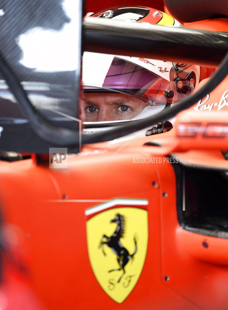 Jens Meyer Ferrari driver Sebastian Vettel of Germany sits on his car during the third Formula One practice session at the Hockenheimring racetrack in Hockenheim, Germany, Saturday, July 27, 2019. The German Formula One Grand Prix will be held on Sunday. (AP Photo/Jens Meyer)