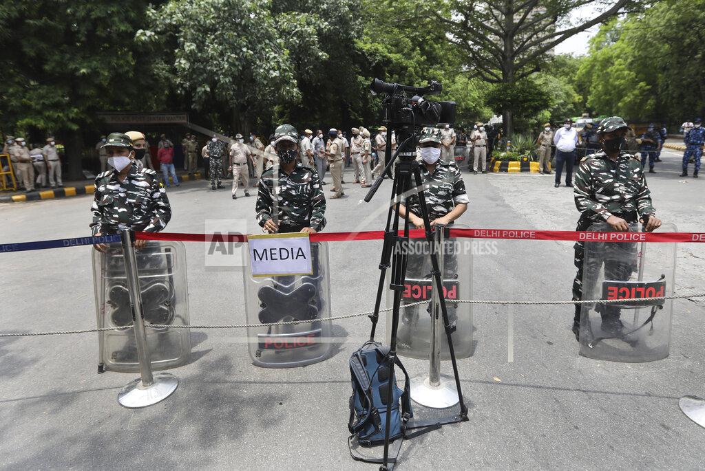 Manish Swarup Indian policemen stand guard at farmers protest site in New Delhi, India, Thursday, July 22, 2021. More than 200 farmers on Thursday began a protest near India's Parliament to mark eight months of their agitation against new agricultural laws that they say will devastate their income. (AP Photo/Manish Swarup)