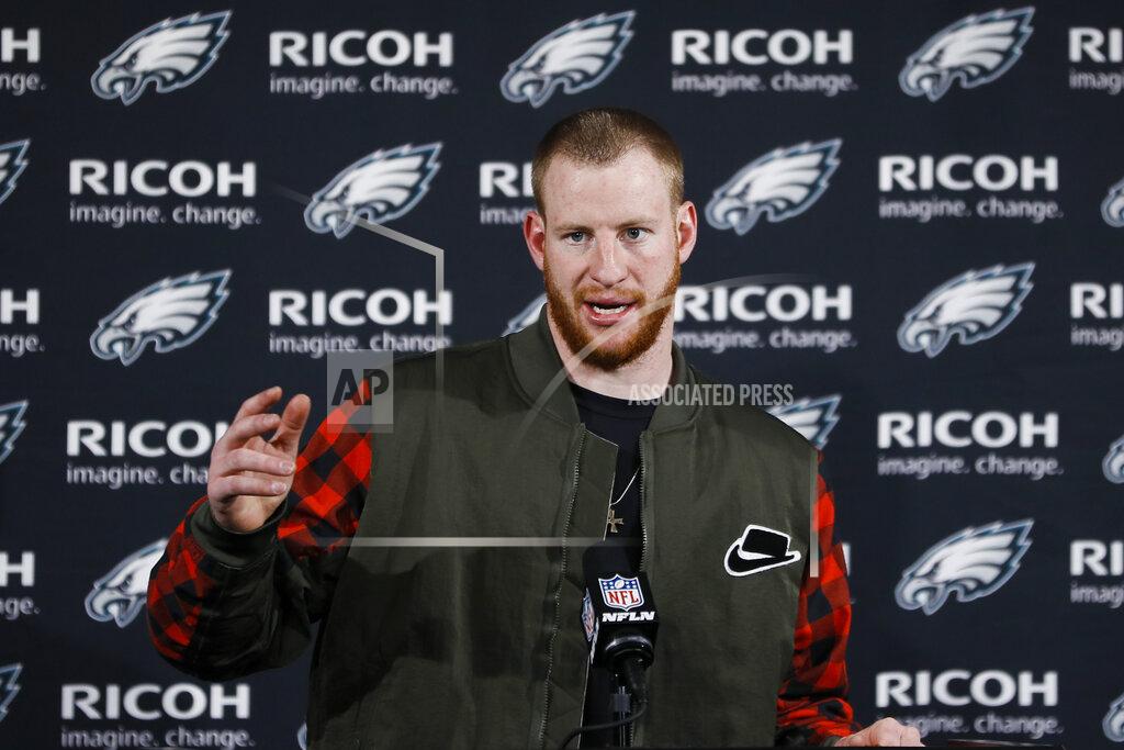 FILE - Philadelphia Eagles quarterback Carson Wentz speaks with members of the media after an NFL football game against the Dallas Cowboys in Philadelphia, in this Sunday, Dec. 22, 2019, file photo. The Philadelphia Eagles have agreed to trade Carson Wentz to the Indianapolis Colts, according to a person familiar with the deal. The person spoke to The Associated Press on condition of anonymity because the deal hasn't been announced. (AP Photo/Michael Perez, File)