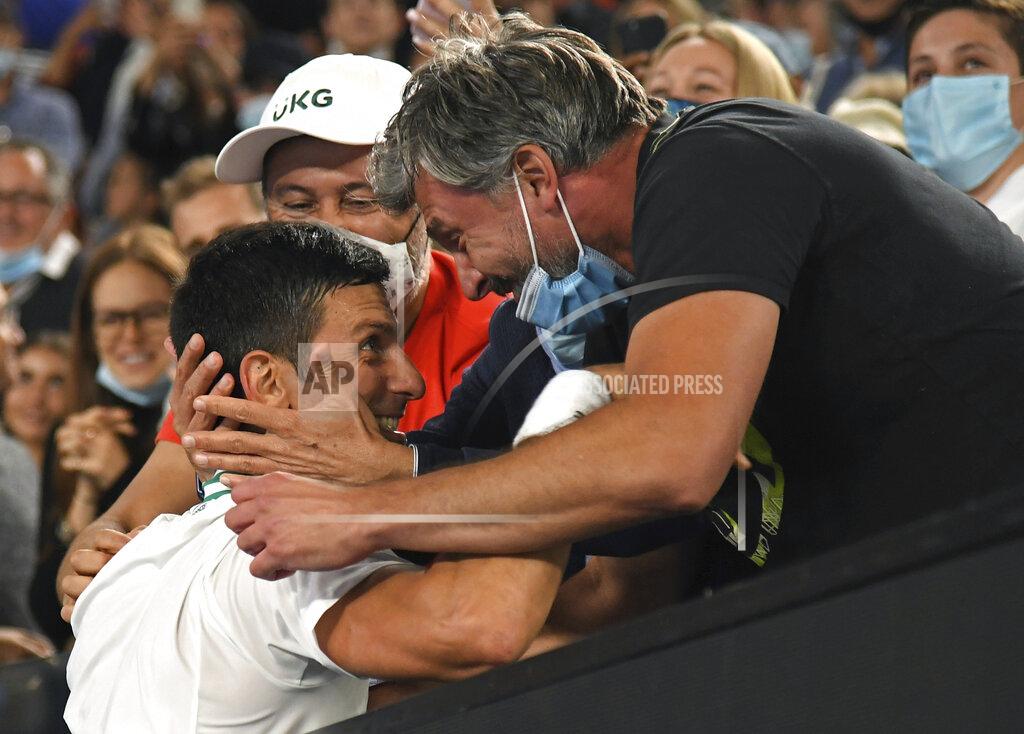 Andy Brownbill Serbia's Novak Djokovic celebrates with Goran Ivanisevic, right, and his support team after defeating Russia's Daniil Medvedev in the men's singles final at the Australian Open tennis championship in Melbourne, Australia, Sunday, Feb. 21, 2021.(AP Photo/Andy Brownbill)