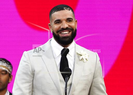 FILE - Drake accepts the artist of the decade award at the Billboard Music Awards on Sunday, May 23, 2021, at the Microsoft Theater in Los Angeles. Drake wants no part in competing for a Grammy. The four-time Grammy winner and his management asked the Recording Academy to withdraw his two nominations from the final-round ballot, a person familiar with the situation told The Associated Press, Monday, Dec. 6, 2021. The person said that Drake’s request was honored by the academy. (AP Photo/Chris Pizzello, File)